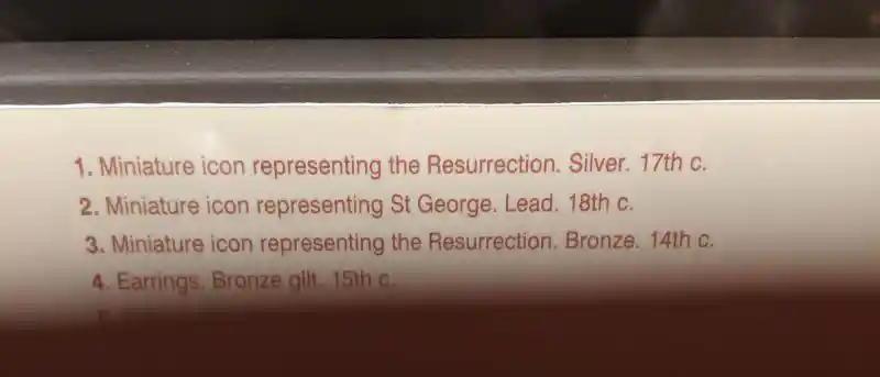 Collection of Byzantine miniature icons showing Resurrection and Saint George with decorative Christian pendants